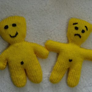 Smiley face and frowny face booboo beanie dolls
